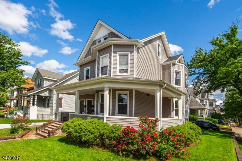 This Beautifully landscaped large corner lot home with 6 parking spaces is Perfect for Homeowners Savvy Investors !