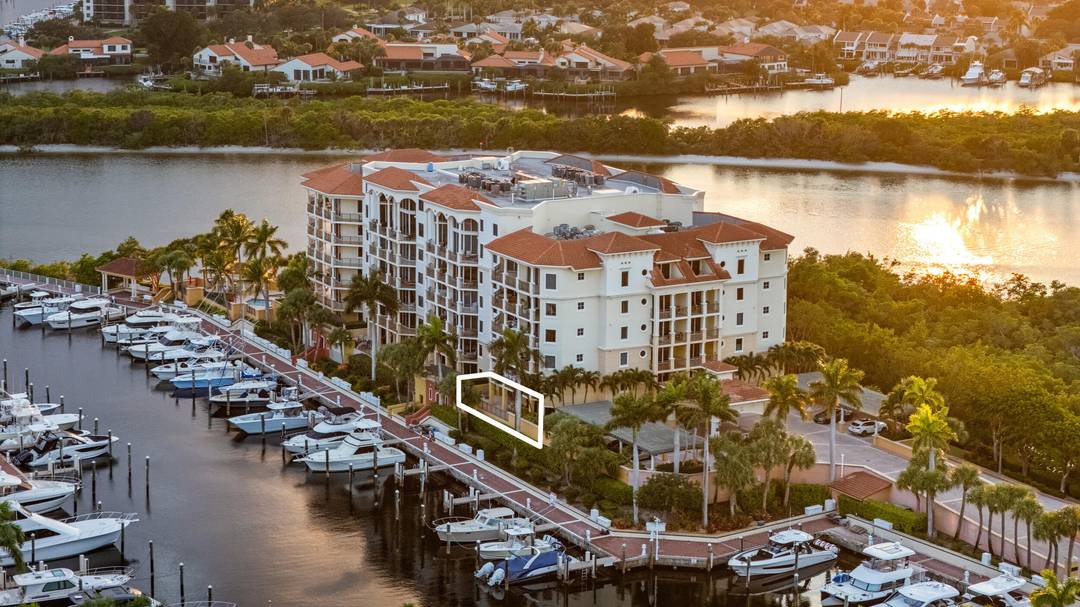 First floor residence in the Point at Jupiter Yacht Club offering rare convenience with a private balcony, porch, and direct marina access.