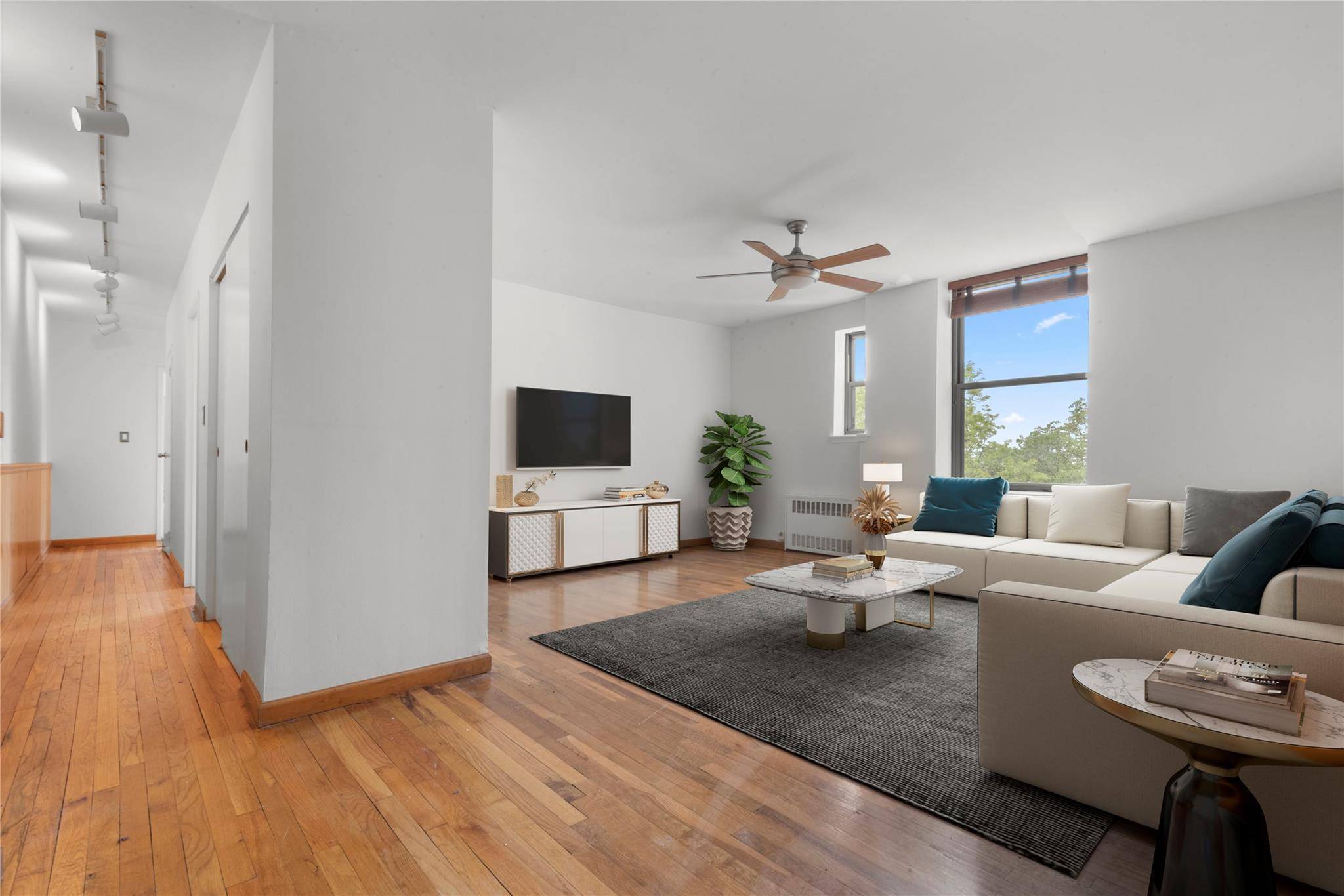Welcome to this 2 bedroom, 2 bath corner unit sitting on the 4th floor of an impeccably maintained, pet friendly elevator building just steps from Fort Tryon Park !