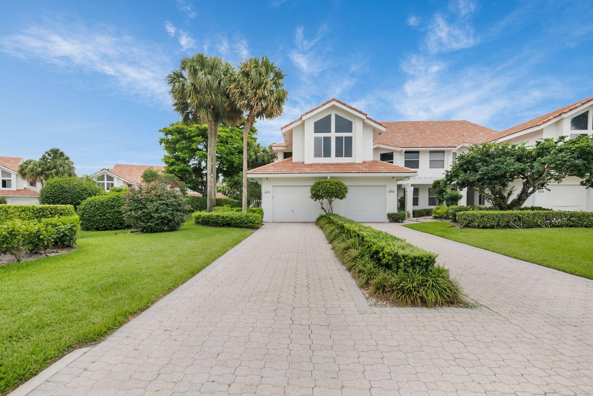 Welcome to your serene retreat in the prestigious Clubside Pointe community of Broken Sound Club.