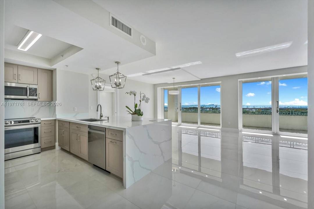 This exceptional and highly sought after 02 line condo at The Ritz Carlton Residences features breathtaking, unobstructed bay and ocean endless water views.