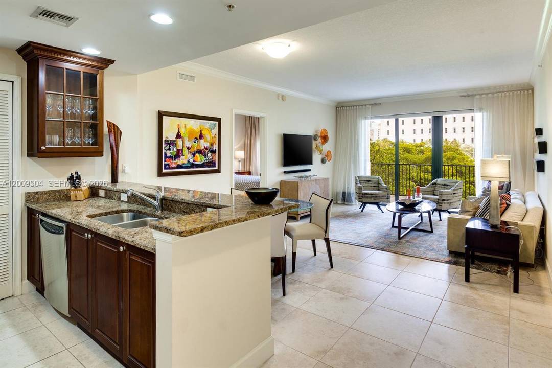 One block from Miracle Mile, Residence 301 at 100 Andalusia pairs downtown Coral Gables walkability with the ease of a boutique, elevator served condominium.