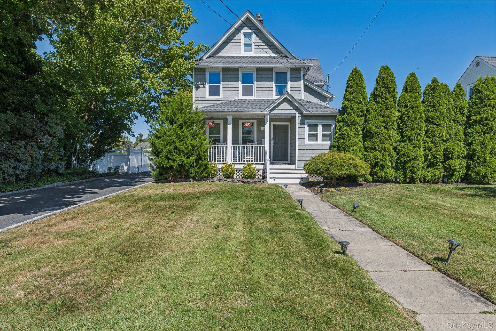 Welcome to 117 Carman Street, a beautifully updated colonial located on a neighborly street just minutes from vibrant downtown Patchogue.