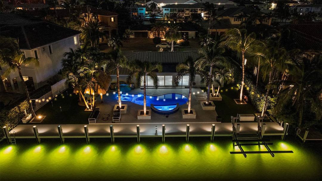 Experience coastal luxury on 110 ft of deepwater in prestigious Lighthouse Point !