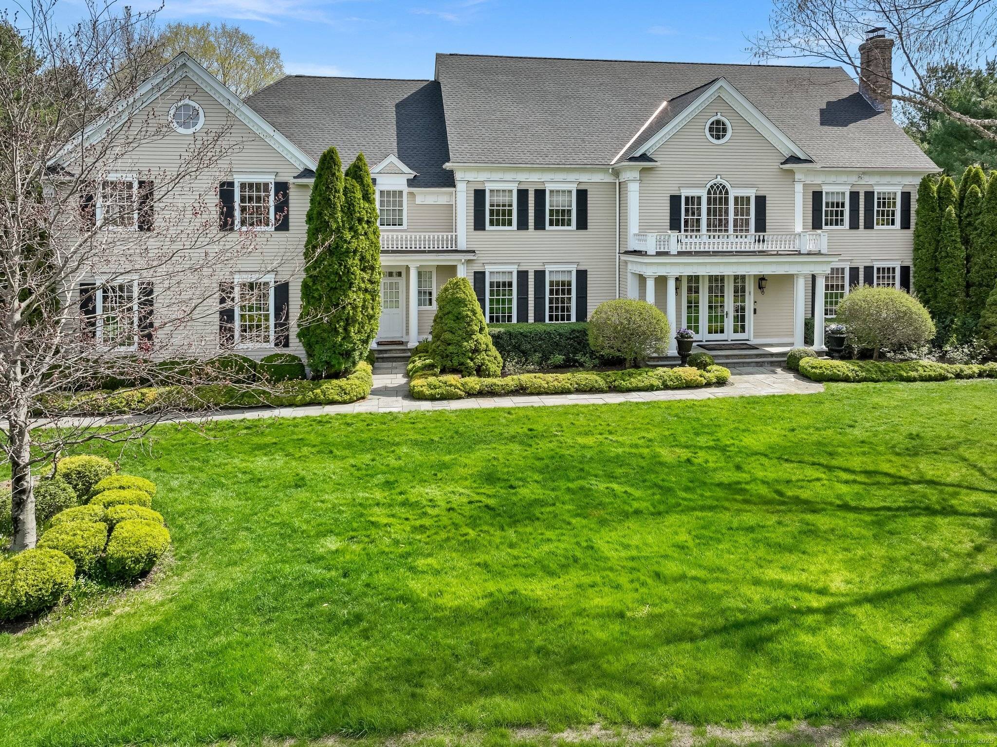 Welcome to Summer Tree Gardens, an extraordinary stately home nestled on over 2 acres of meticulously maintained grounds in the prestigious Greenfield Hill neighborhood of Fairfield, CT.