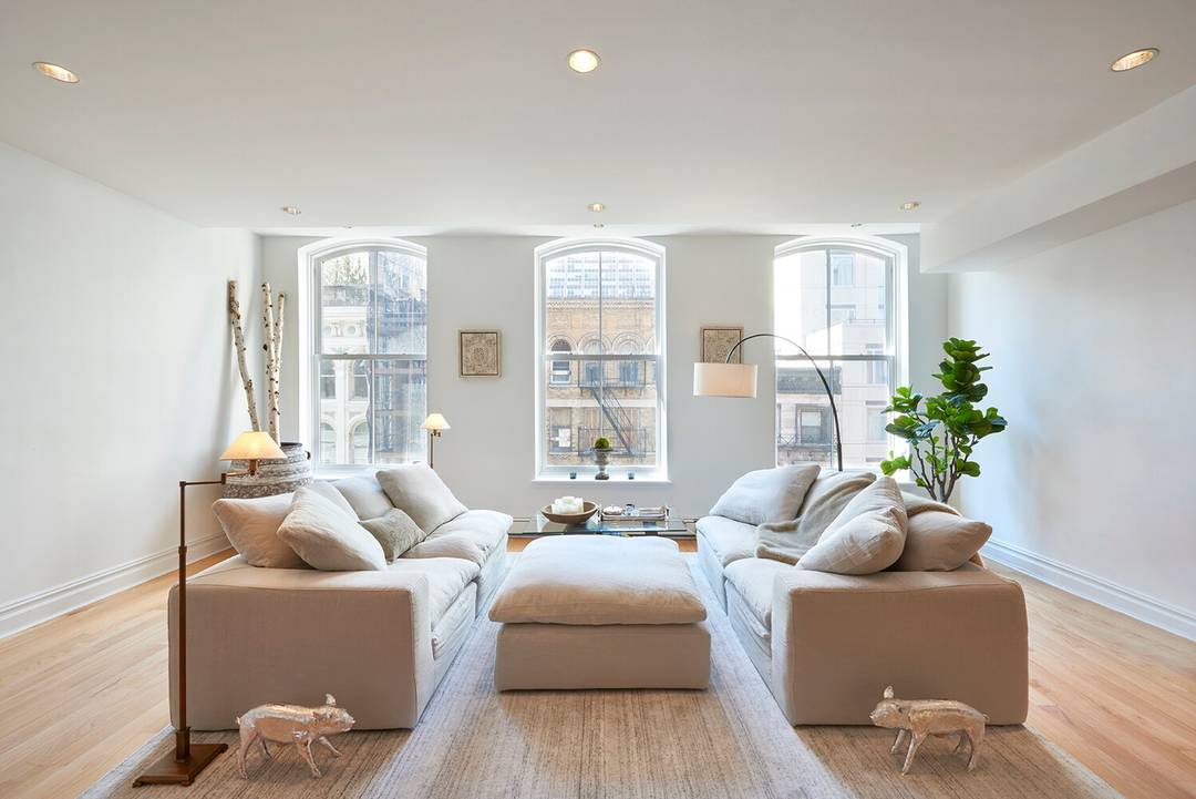 The elevator opens directly into this bright, full floor loft.