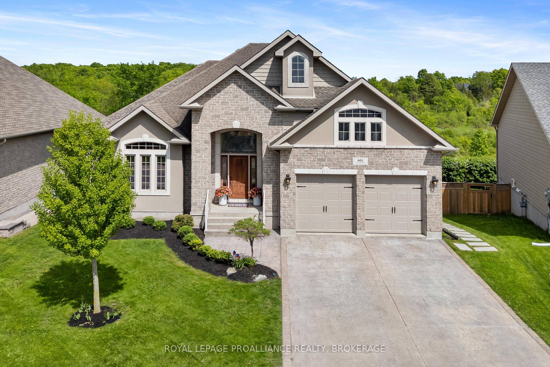 Welcome to 601 Fieldstone Drive a custom built showpiece nestled on one of East Kingston's most sought after streets, backing onto the peaceful green space of Butternut Creek.