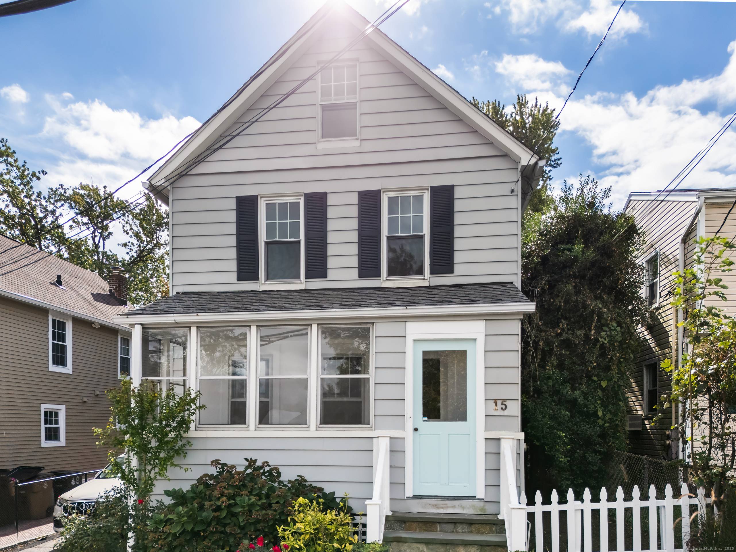 Welcome to coastal living at its finest in this charming 1910 Colonial, just a short walk from Cove Island Park and beach.