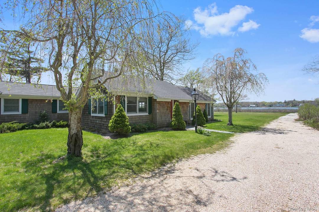 Discover a tranquil haven in this charming 2 bedroom, 2 bathroom waterfront cottage, beautifully situated in the peaceful community of Quogue.