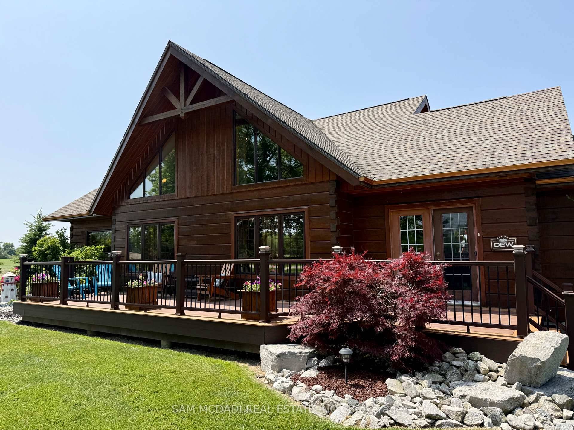 Welcome to this truly one of a kind, custom built log style home set on a sprawling private lot where rustic charm meets modern luxury.