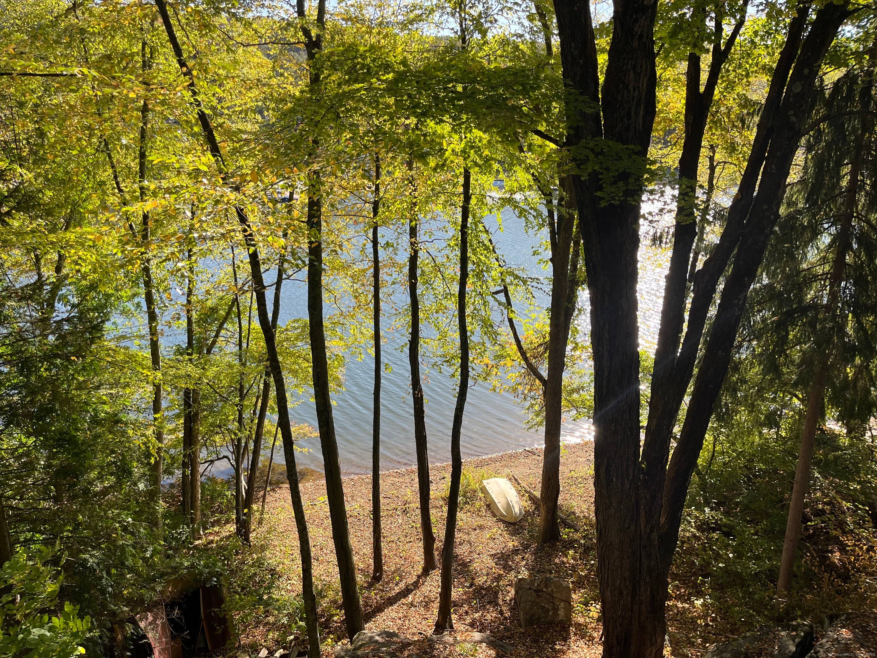 Fixer upper on waterfront lot with approximately 100 feet on Squantz Pond !