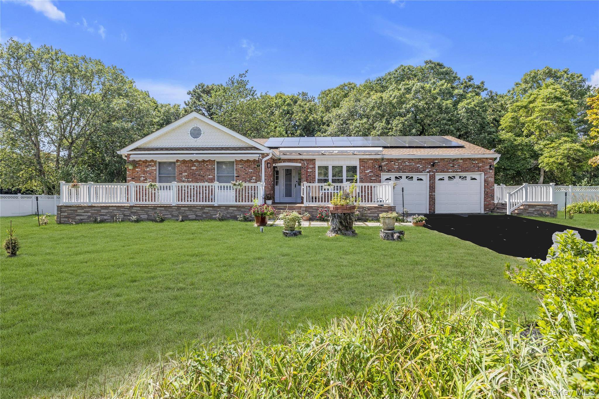 Welcome to this turn key fully updated ranch situated on a half acre of lush landscaped property.