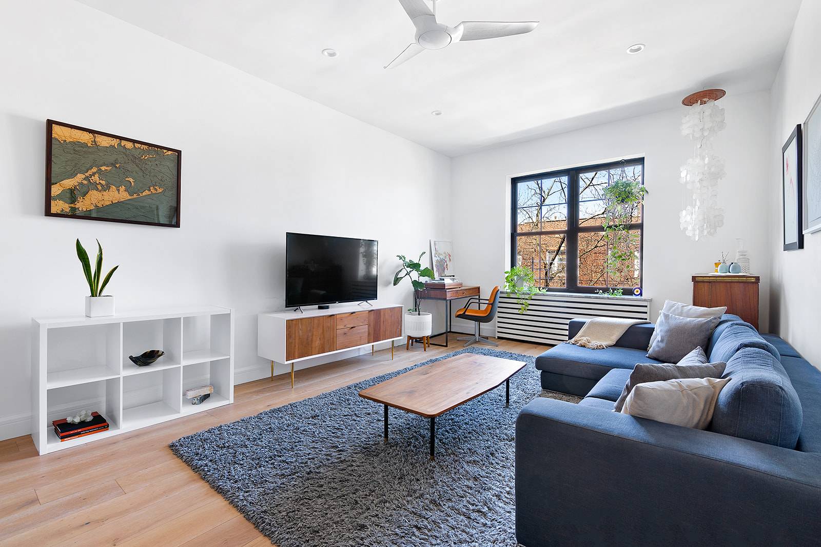 Situated on a tree lined street in Prospect Heights, comes this light filled and flawlessly turnkey, fully renovated 2 bedroom 2 bath designed by two architects.