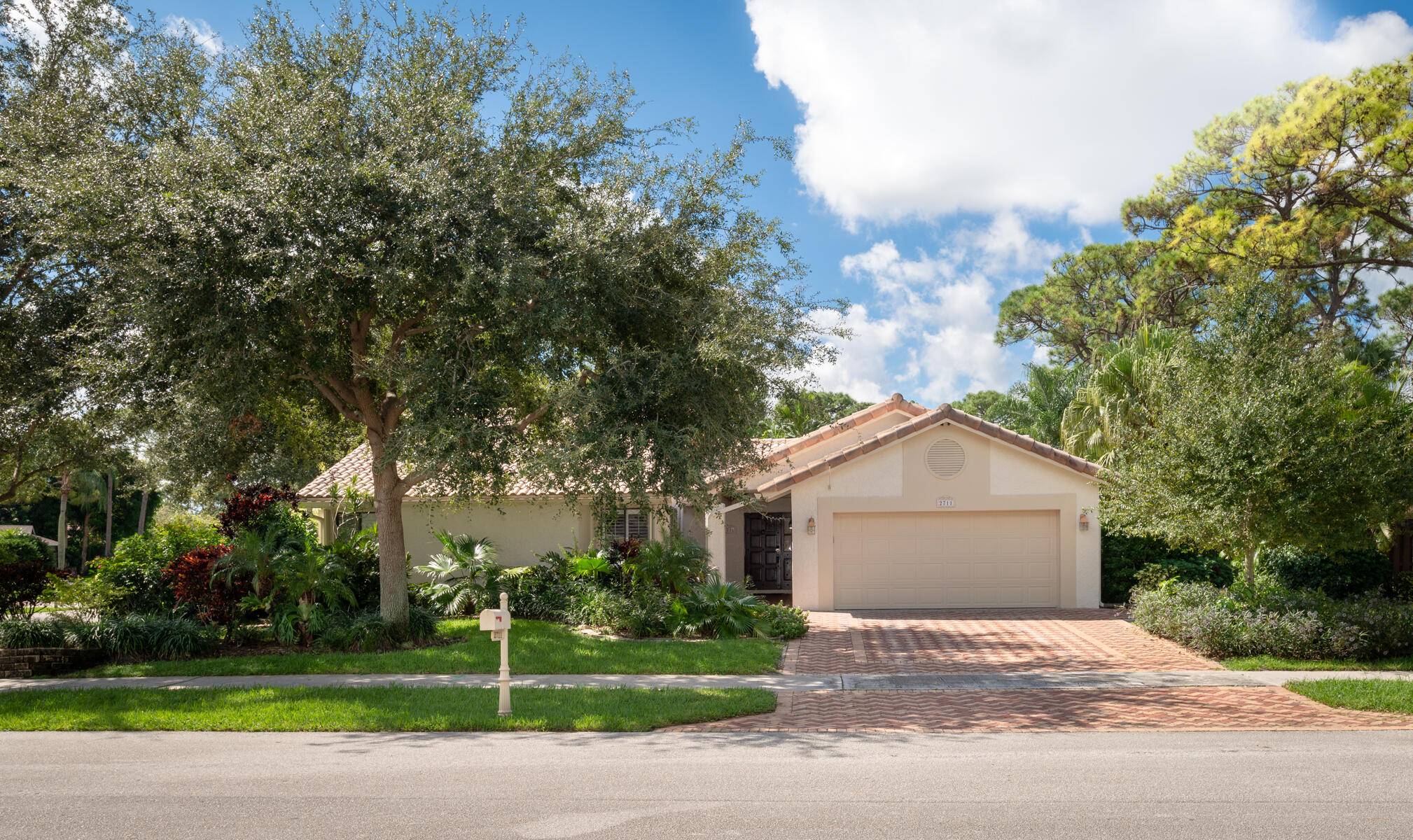Gorgeous 3 bdrms, 2 bths corner lot home with pool, 2 car garage with an extra wide paver driveway and beautiful landscaping.
