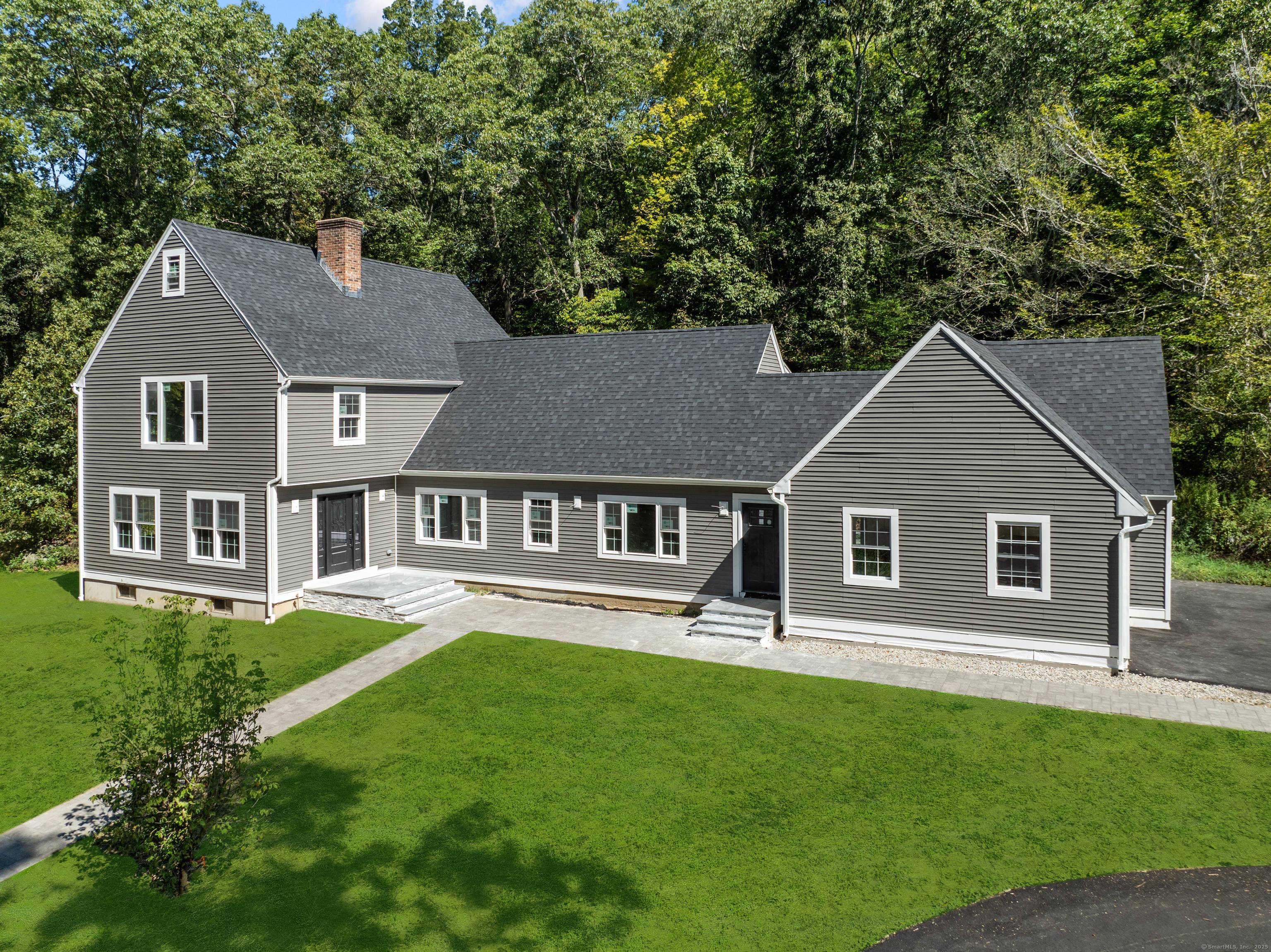 Nestled along a peaceful country road, this stunning 5 bedroom, 4 bath Colonial offers over 4, 600 square feet of living space with hardwood floors throughout and beautifully tiled bathrooms.