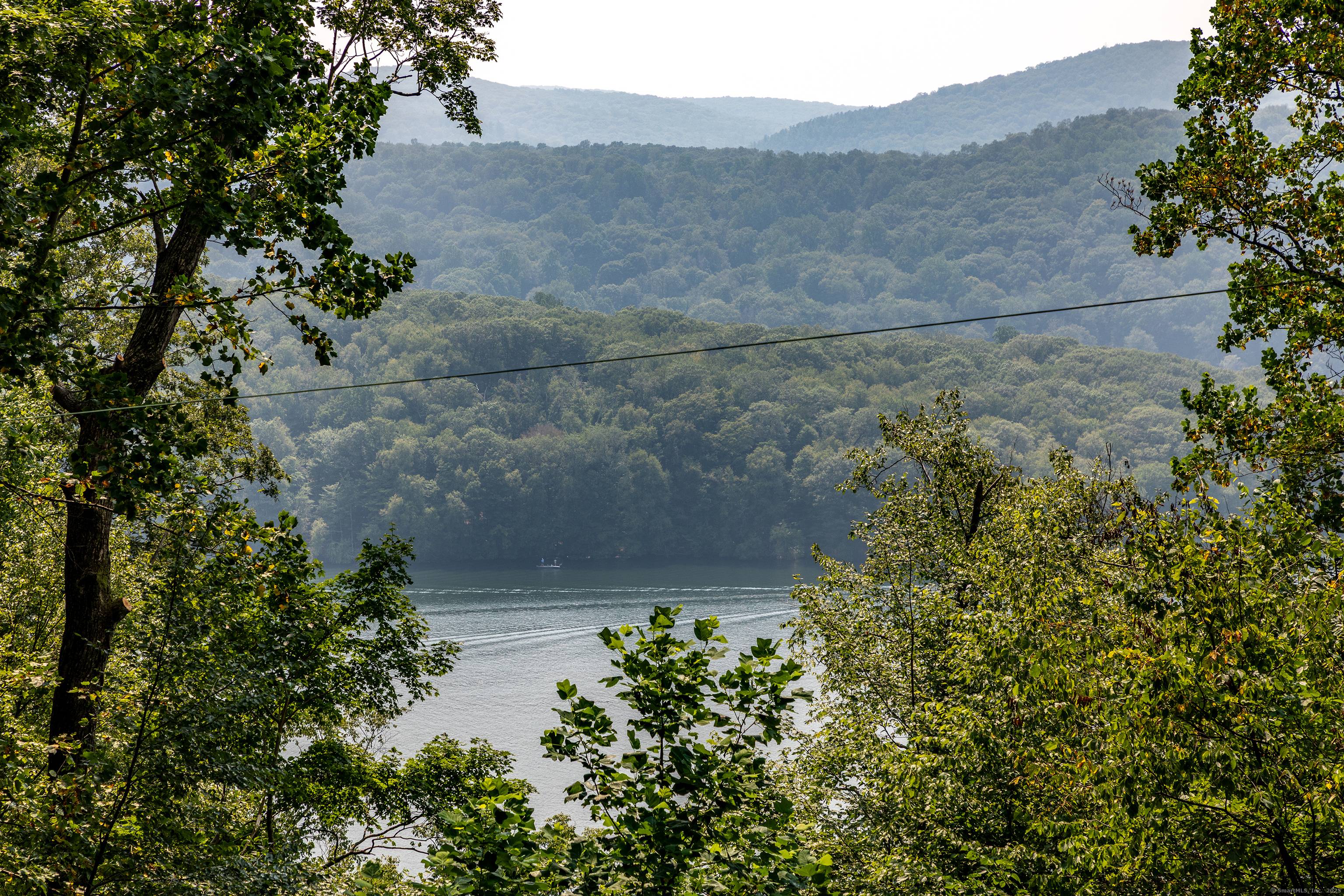 Happy Hill in Candlewood Lake Estates Discover lake community living and the feeling of being on vacation year round in this private, gated community featuring four residents only beaches.