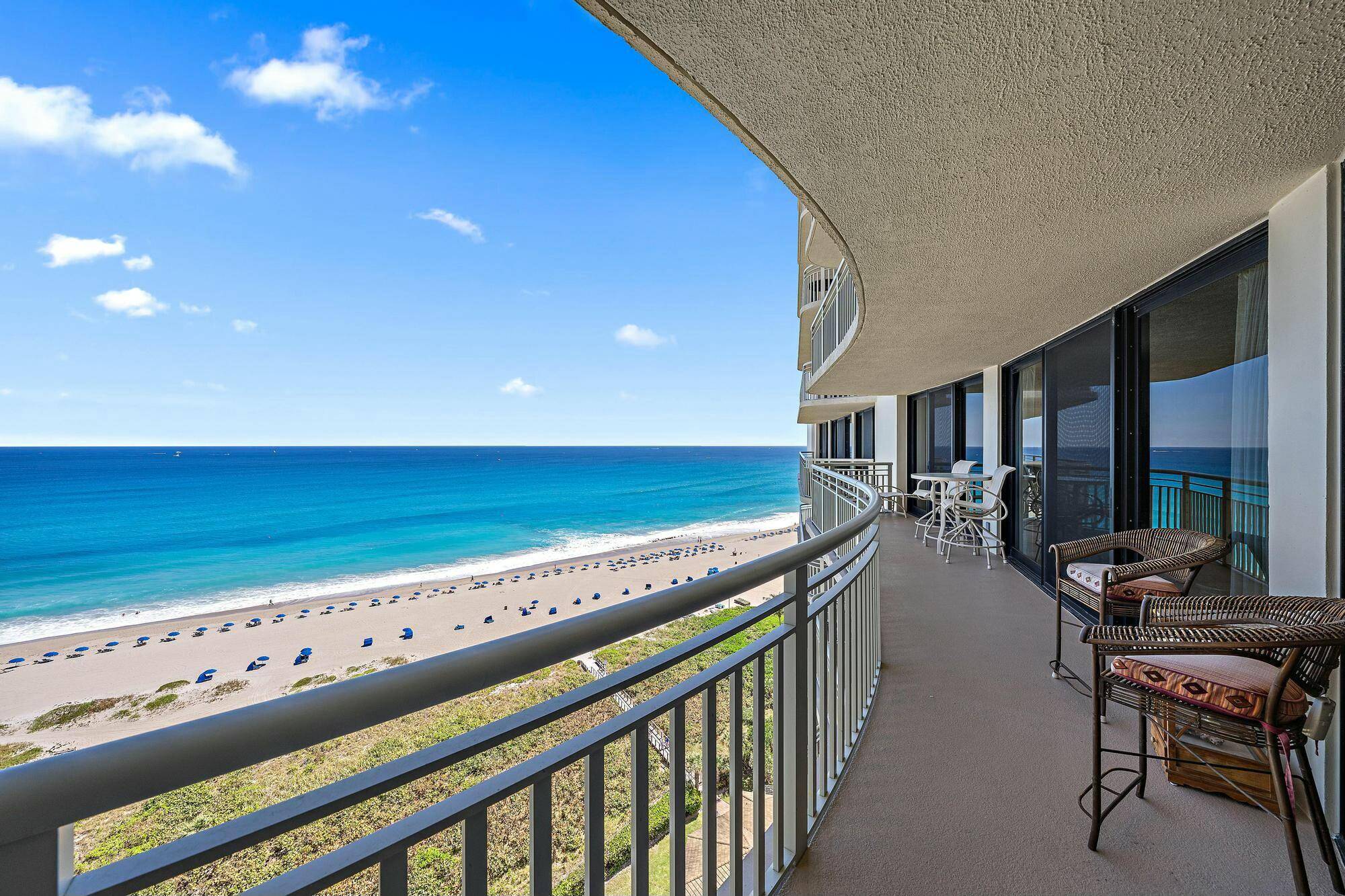 Direct oceanfront views with wide balcony featuring impact glass sliders, tile throughout, granite counter tops in the kitchen and baths, washer dryer inside the unit.