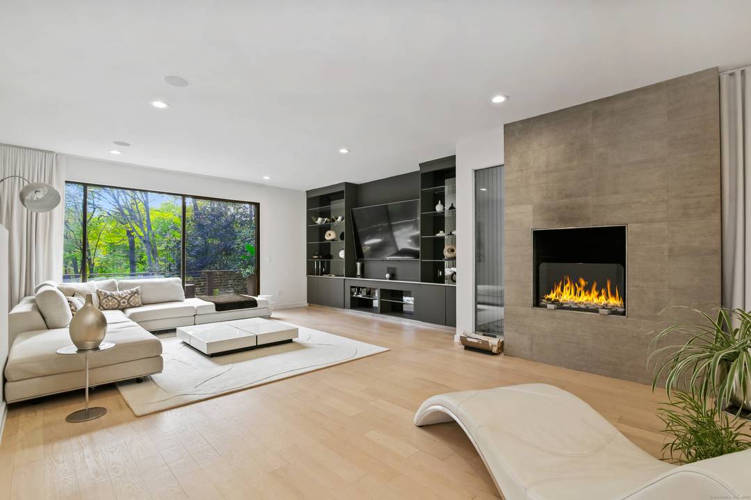 Welcome to 210 Red Fox Road, a stunning hilltop sanctuary nestled on a quiet cul de sac in Stamford, CT.