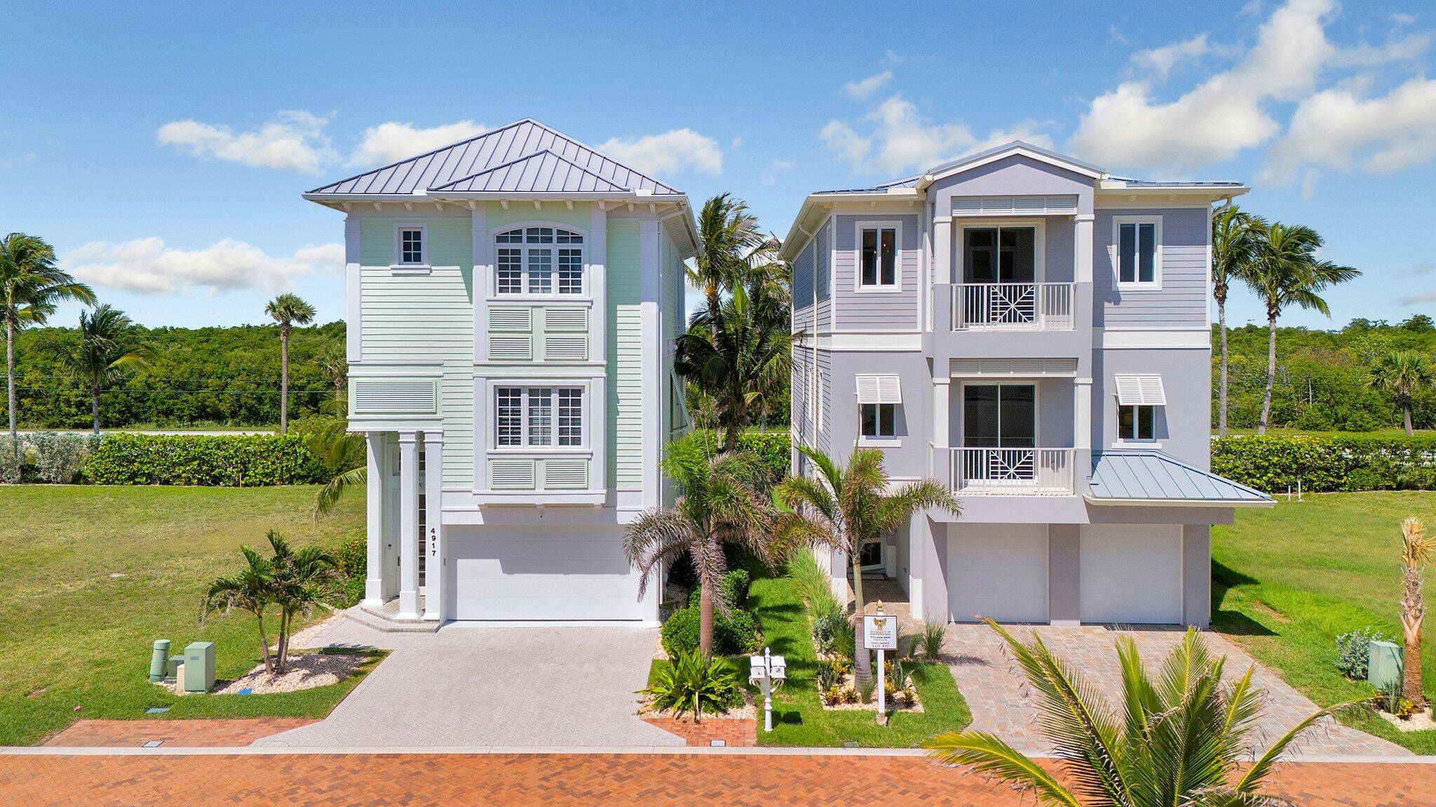 Paradise found in this 3 story oceanview home in the exclusive Watersong community on Hutchinson Island.