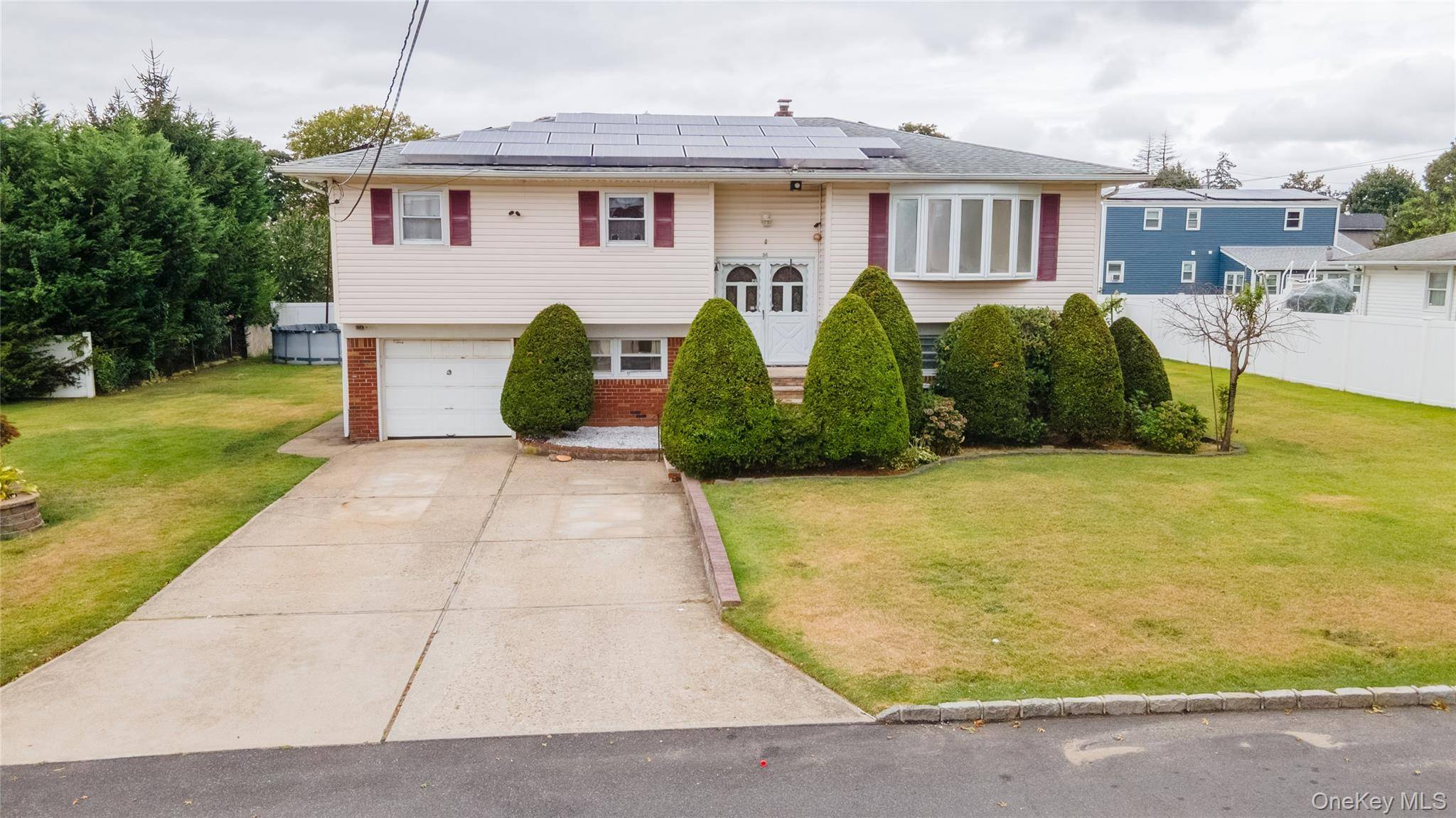welcome to this Oversized Custom Built High Ranch, This spacious home features 7 generously sized bedrooms, 4 bedrooms in the main level and 3 bedrooms in the bottom level.