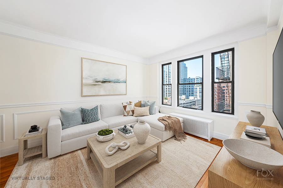 Located on a high floor in a pre war building in the Lincoln Center area, this spacious bright one bedroom has a well proportioned living dining room with beautiful open ...
