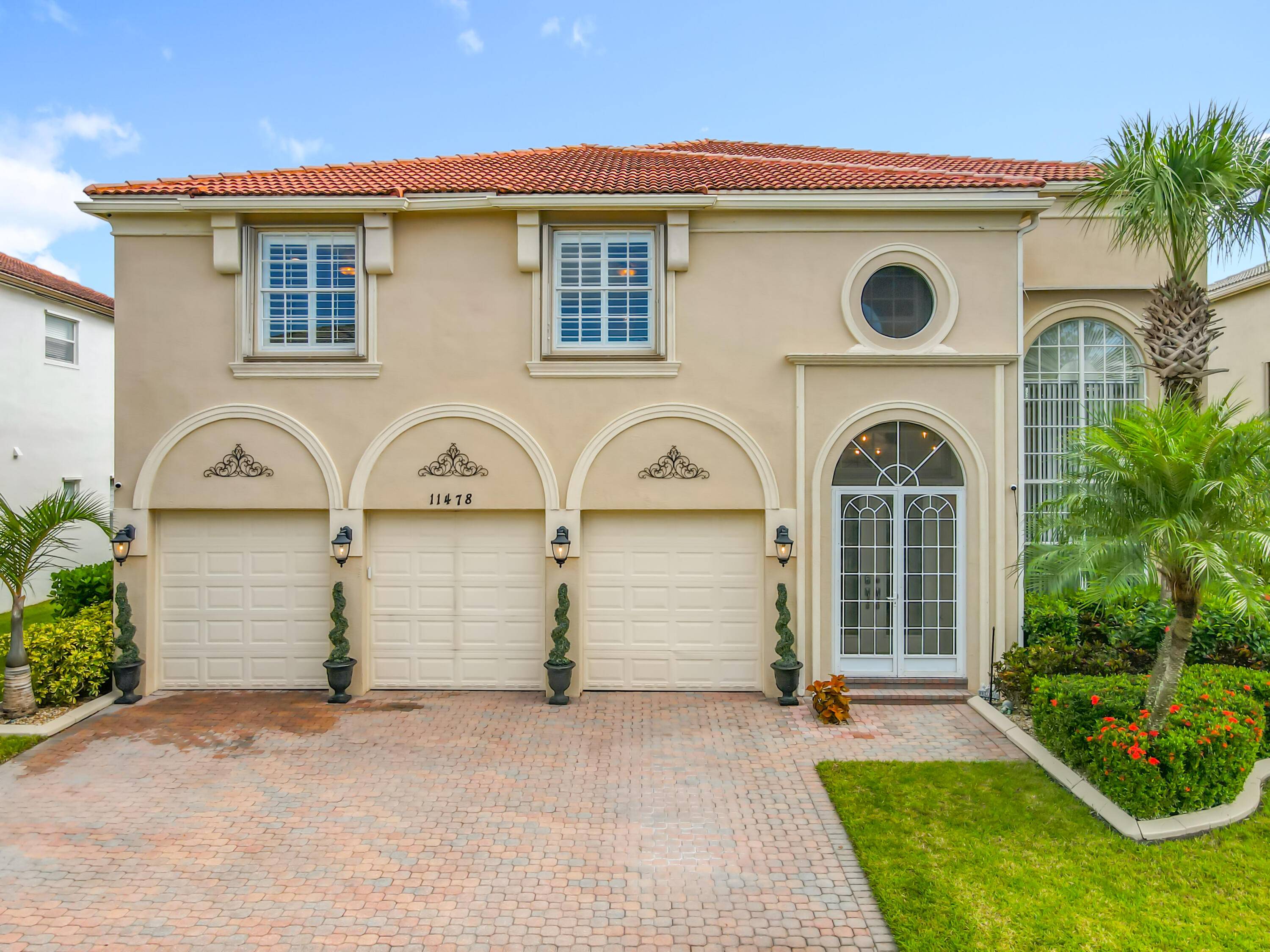 Luxurious 5 bedroom plus office 4 full bath POOL home with 3 car garage in the exclusive community of Fieldstone in Town Park at Tradition.