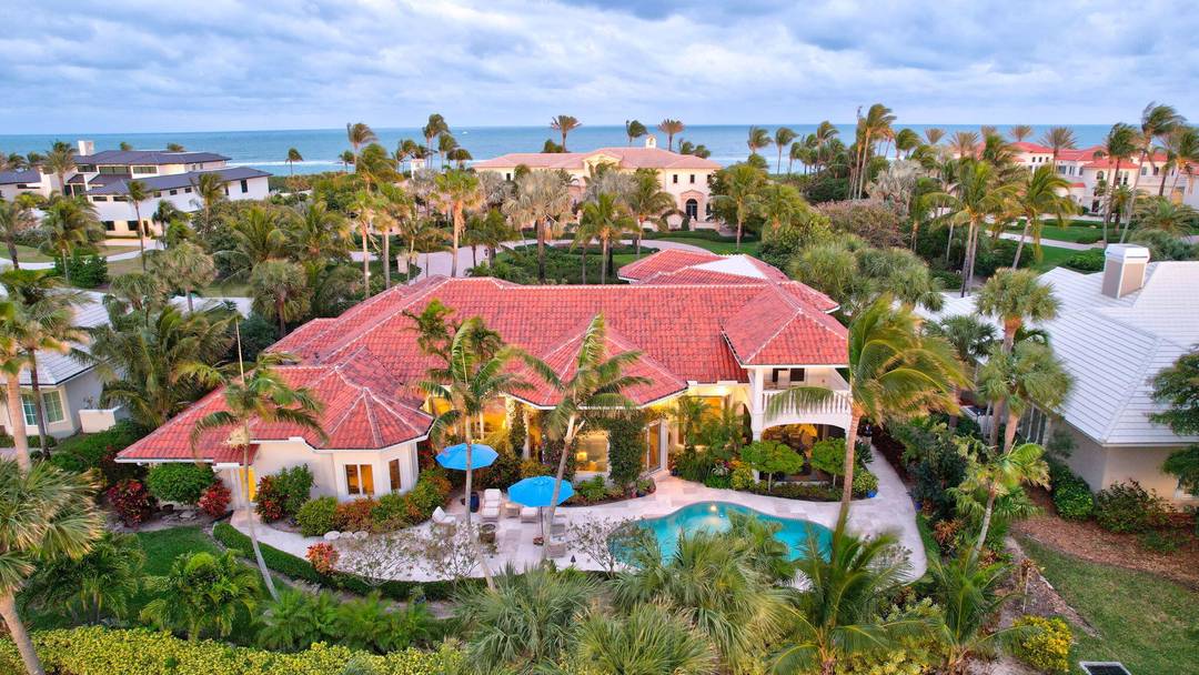 Experience the luxury and elegance of this Sailfish Point estate, ideally positioned on the Jack Nicklaus 'Signature' golf course, across the street from the ocean.