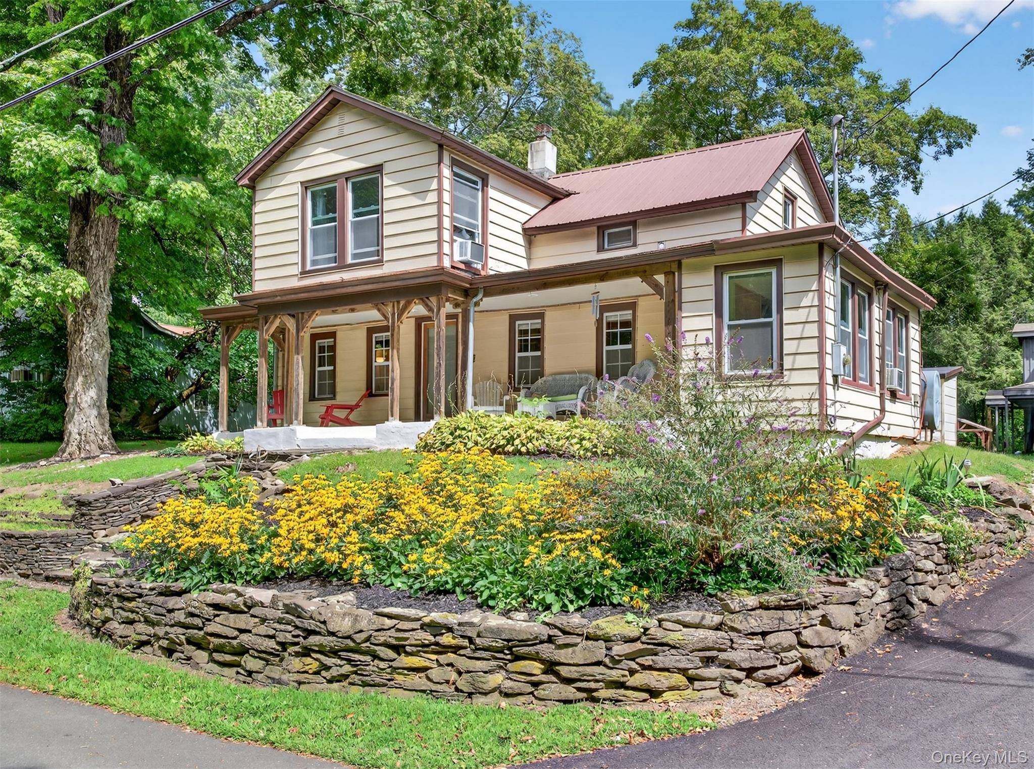 This distinctive home blends historic character with modern comfort, featuring exposed wooden beams and plenty of personality.