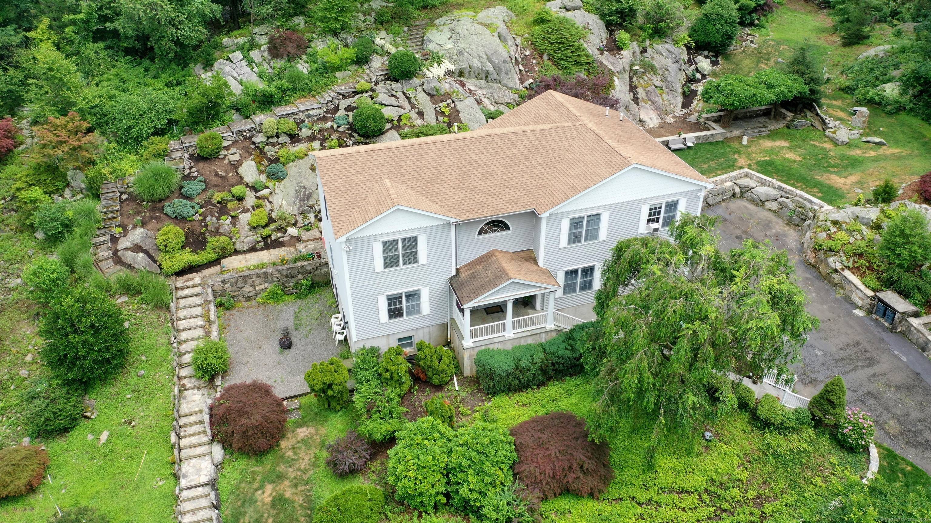 Built in 1999 and beautifully maintained, this young Colonial sits on 2 private, picturesque acres in one of North Stamford's most sought after locations.