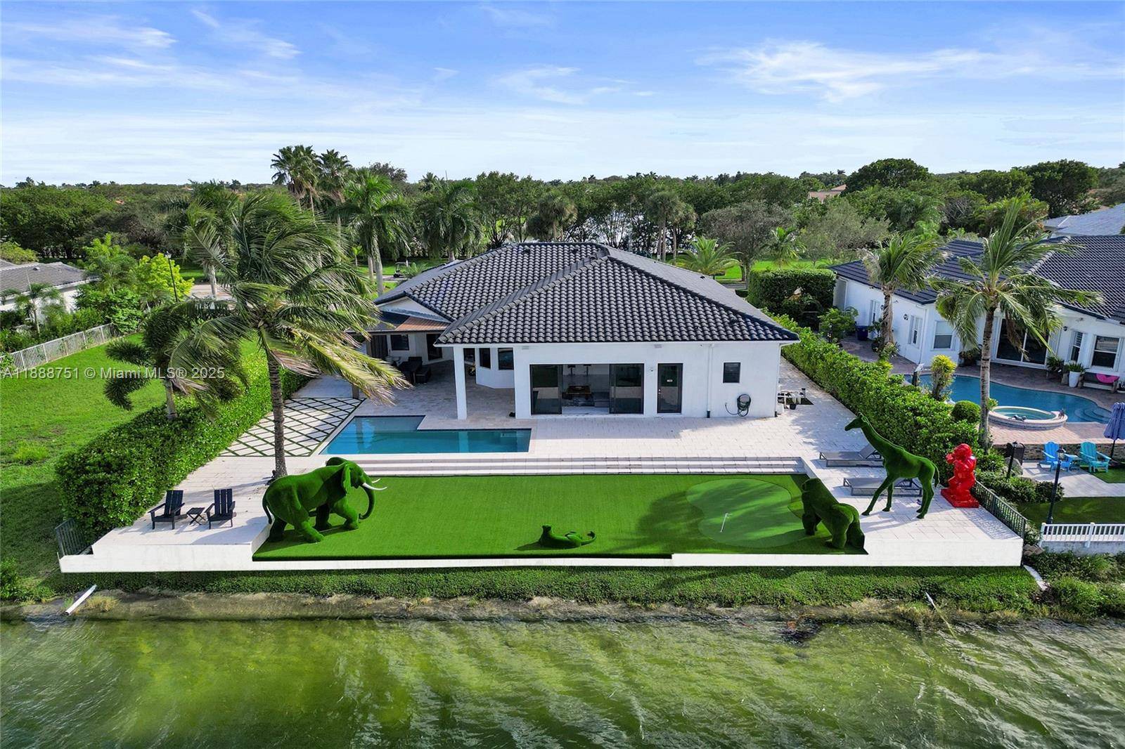 Welcome to this stunning 5BR 3BA lakefront estate in the exclusive Harbour Lakes community of Miramar !