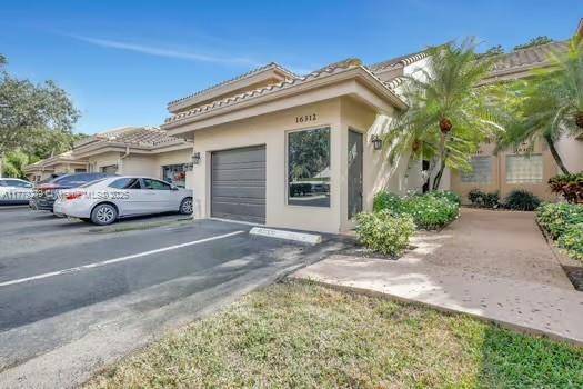 Welcome to this beautifully maintained 3 bed, 2 bath townhome in the heart of Weston.