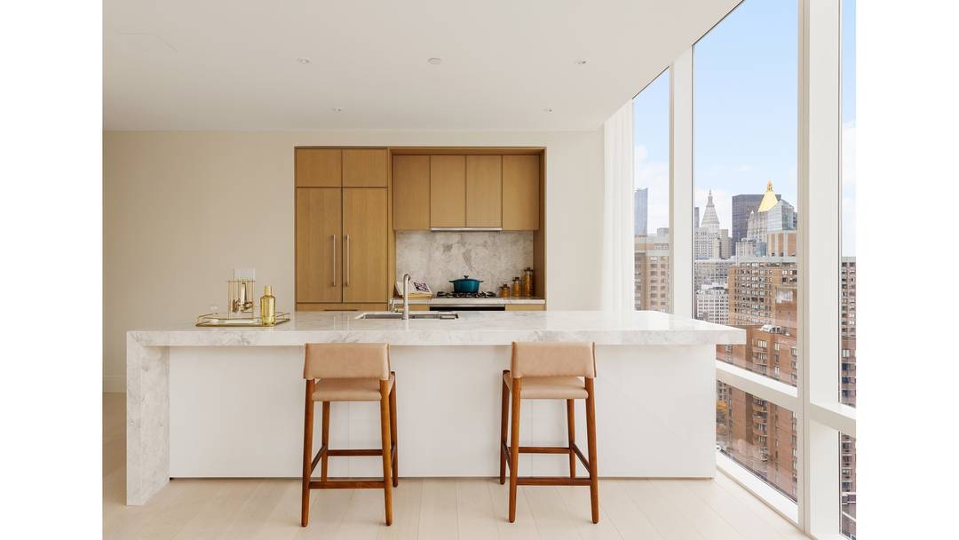 An Expansive Corner 2 Bedroom with a Sprawling Wrap Around Terrace Residences Feature Bosch in residence washer and dryer 7 white oak plank flooring Deluxe white marble kitchen countertops Premium ...