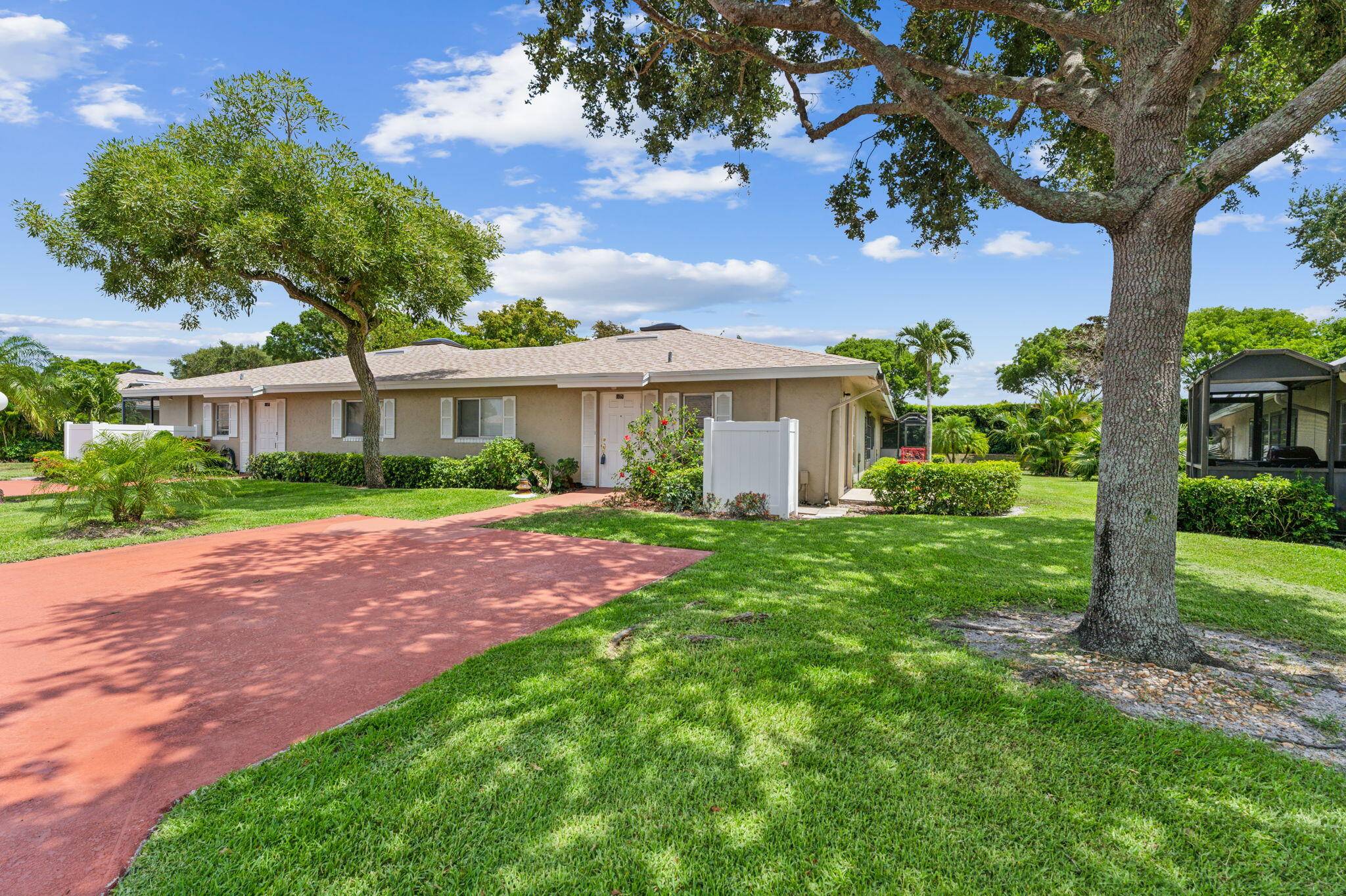 Step into your private retreat with this charming single story corner villa, perfectly nestled in a gated community surrounded by lush landscaping.