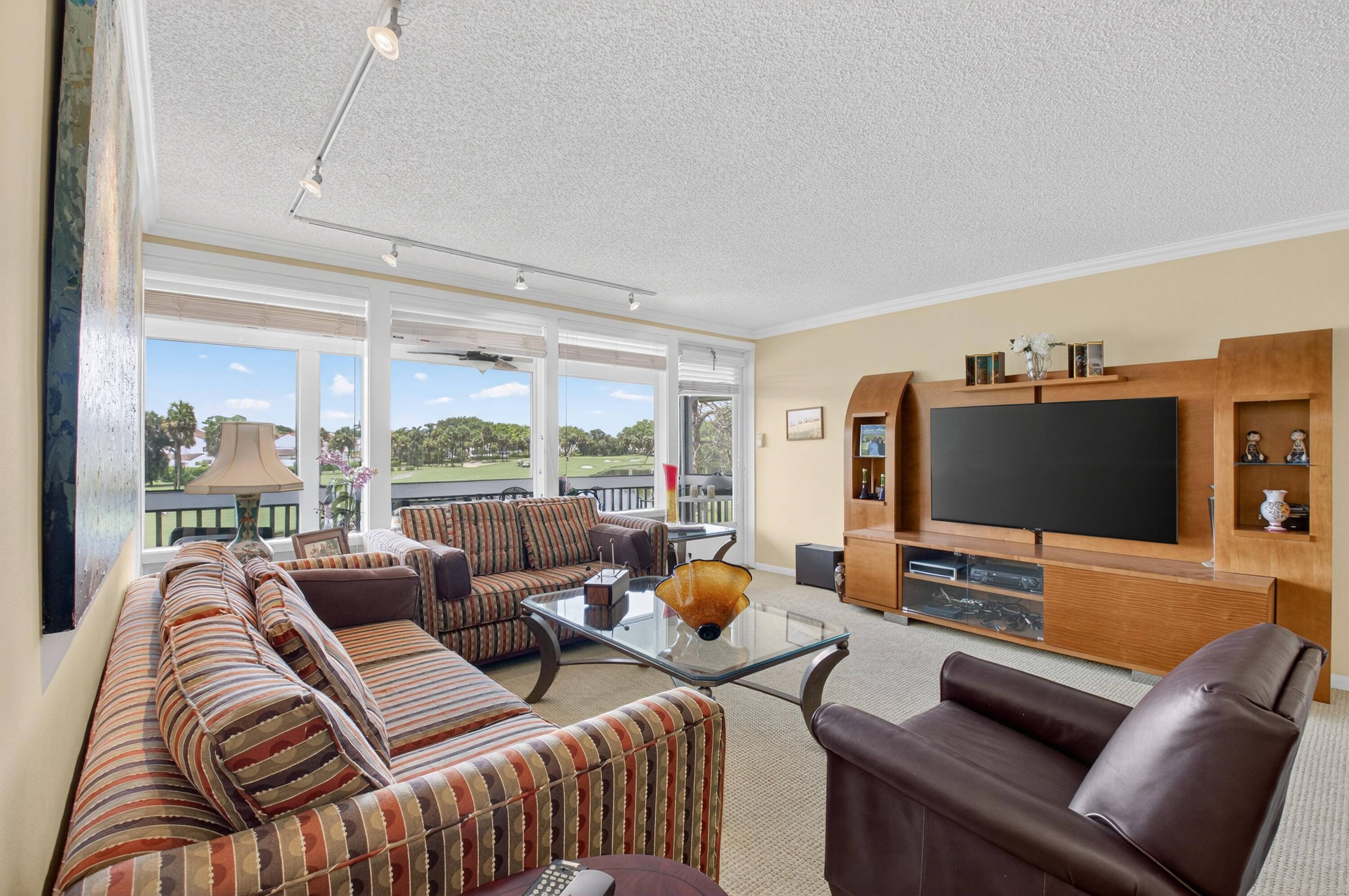 Enjoy stunning and expansive lake and golf views from large screened in balcony.