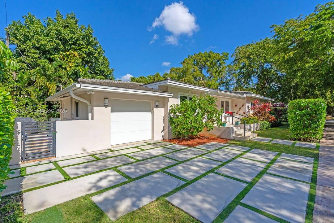 Stunningly remodeled 3 bedroom, 2 bath residence located on one of Coral Gables most iconic and tree canopied streets.