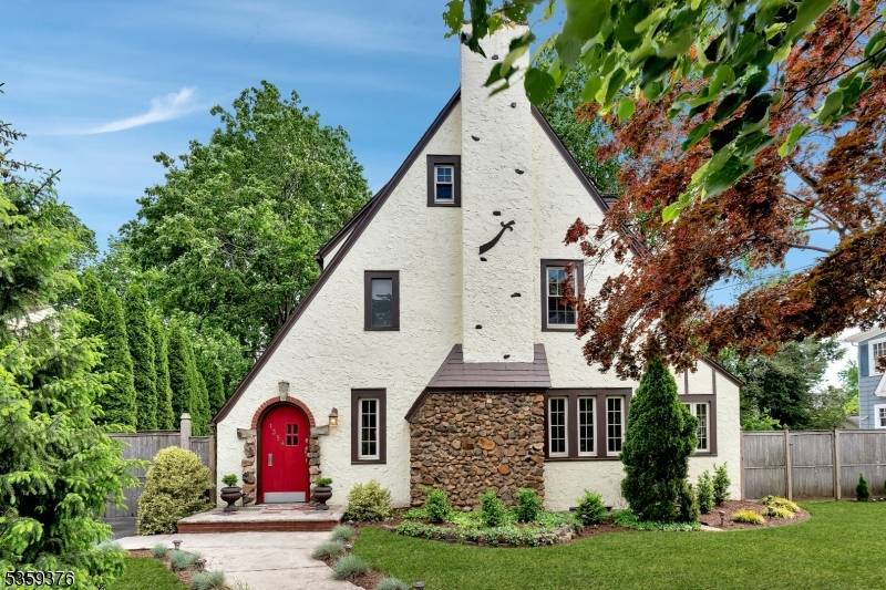 Welcome to this stunning four bedroom, two full bath, and one half bath classic Tudor style home located in one of Plainfield's most desirable East end neighborhoods.