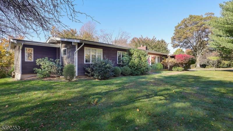 Welcome home to this stunning ranch perfectly situated on a level, one acre lot with a gorgeous, flat rear yard and spacious deck overlooking mature trees ?