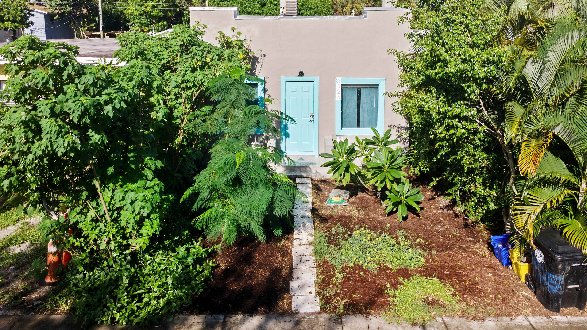 Charming Spanish Colonial style home in Lake Worth Beach with 2 bedrooms, 1 bathroom, and a den perfect for an office space.