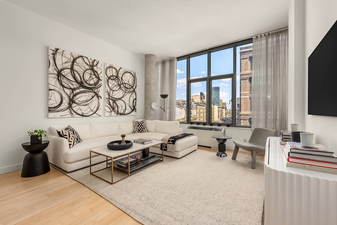 This spectacular two bedroom, two bath home is ideally situated at the crossroads of SoHo and NoLita, offering sweeping open city views with stunning eastern exposure overlooking the Williamsburg Bridge.