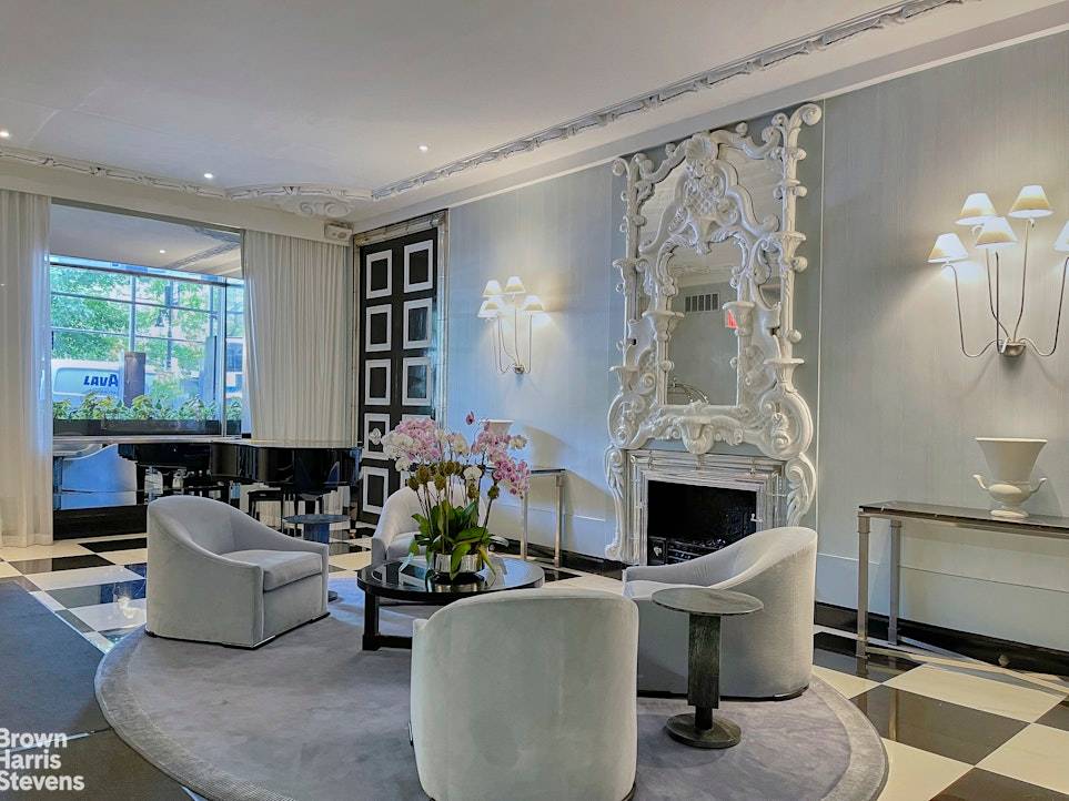 Enjoy loft like living in this unique Central Park South one bedroom residence with new kitchen, elegant entry foyer and a home office.
