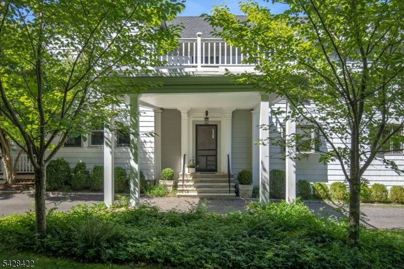 Circa 1905 and rooted in the Gilded Age history of the Bernardsville Mountain, this remarkable country residence was once part of industrialist Charles Pfizer's renowned Yademos estate.