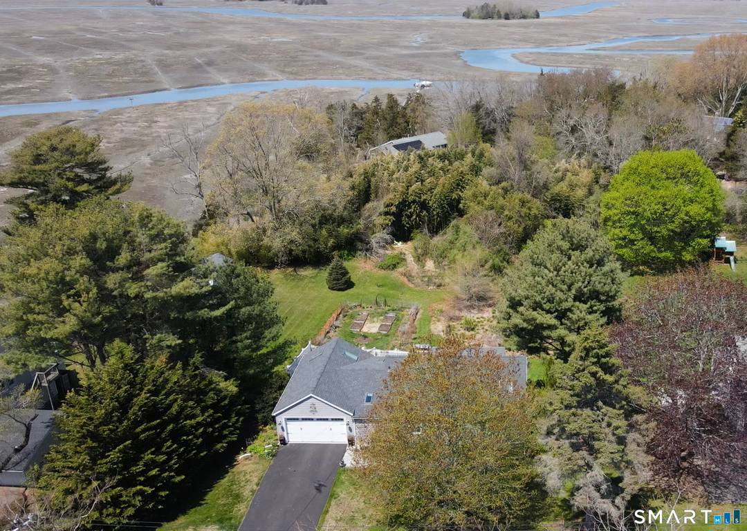 Enjoy stunning views of the Neck and more distant East Rivers and the abundant wildlife they support from a recently renovated sunroom and adjacent deck.