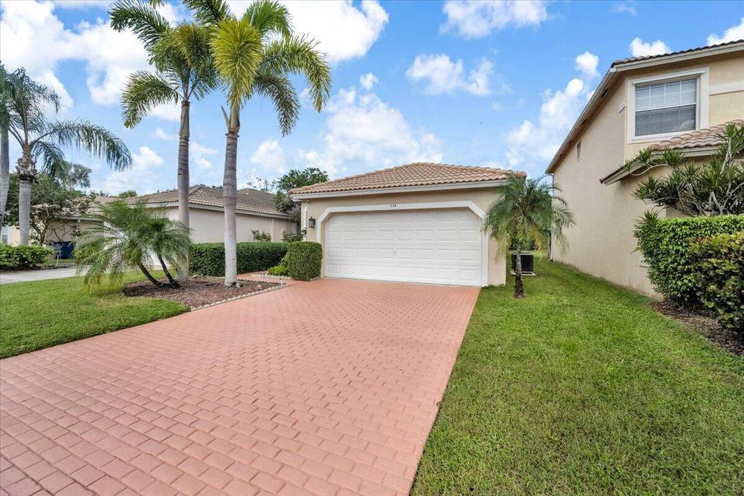 Welcome to your stunning dream home in the gated community of ''Country Club Views'' in Royal Palm Beach with Pond Golf Course Views !