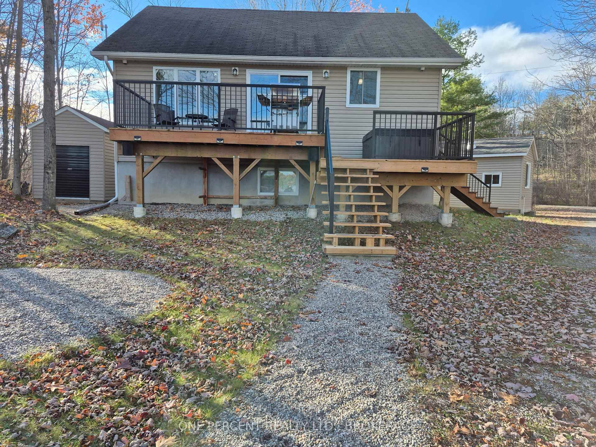 Enjoy Waterfront Living Year Round in this Charming FULLY FURNISHED 4 season, 2 Bedroom Custom Build Bungalow on Troy Lake With Superior Finishings.