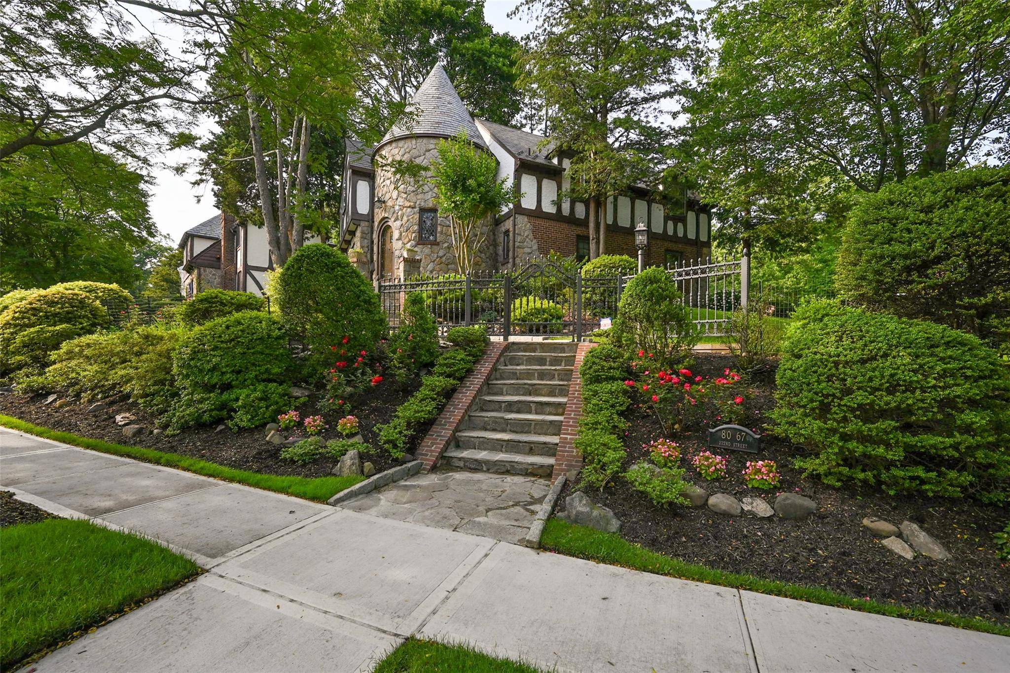 One of a kind Tudor in Hollis Hills prestigious Surrey Estates.