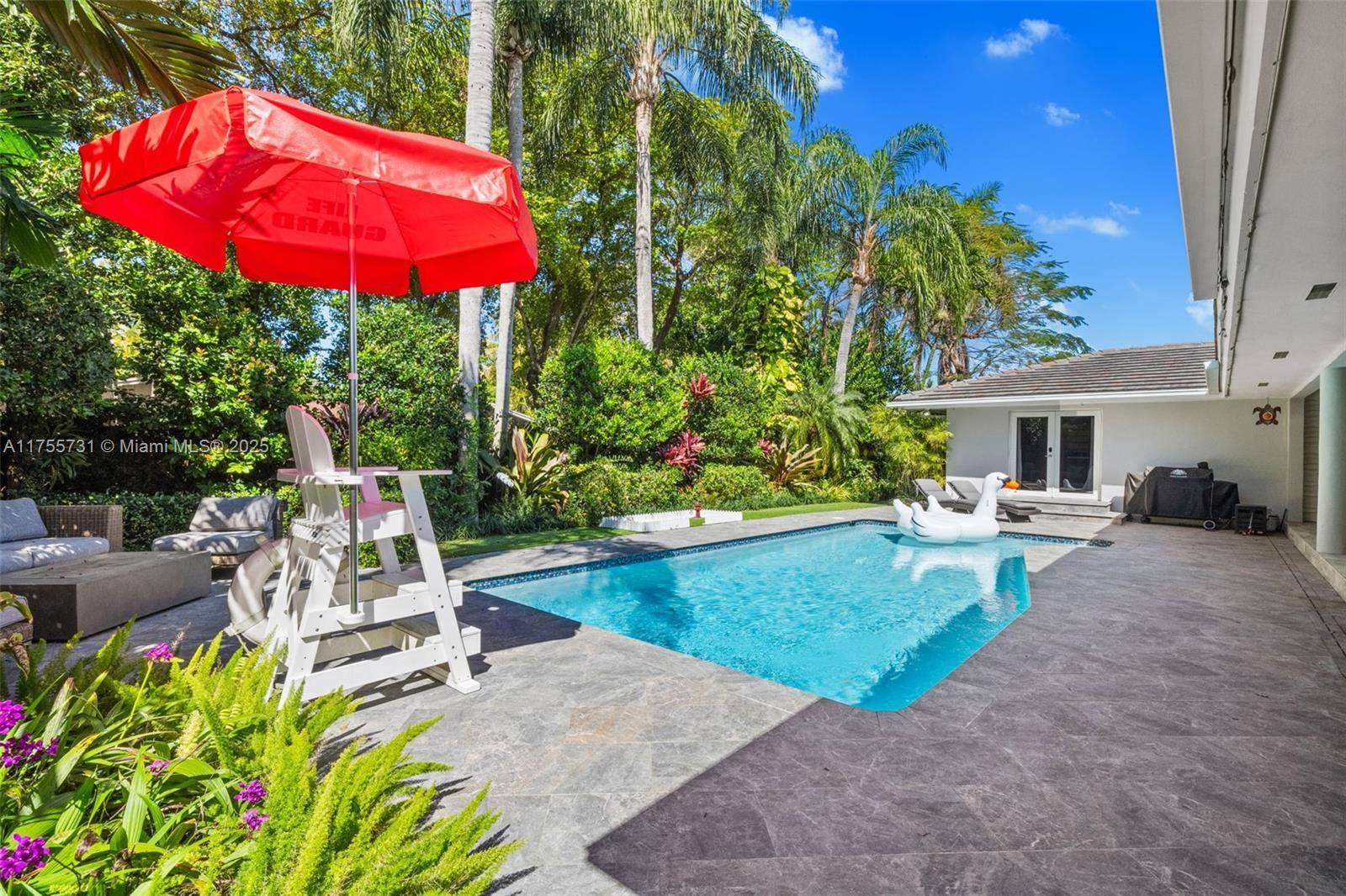 Grand South Miami Estate on a serene and private cul de sac.