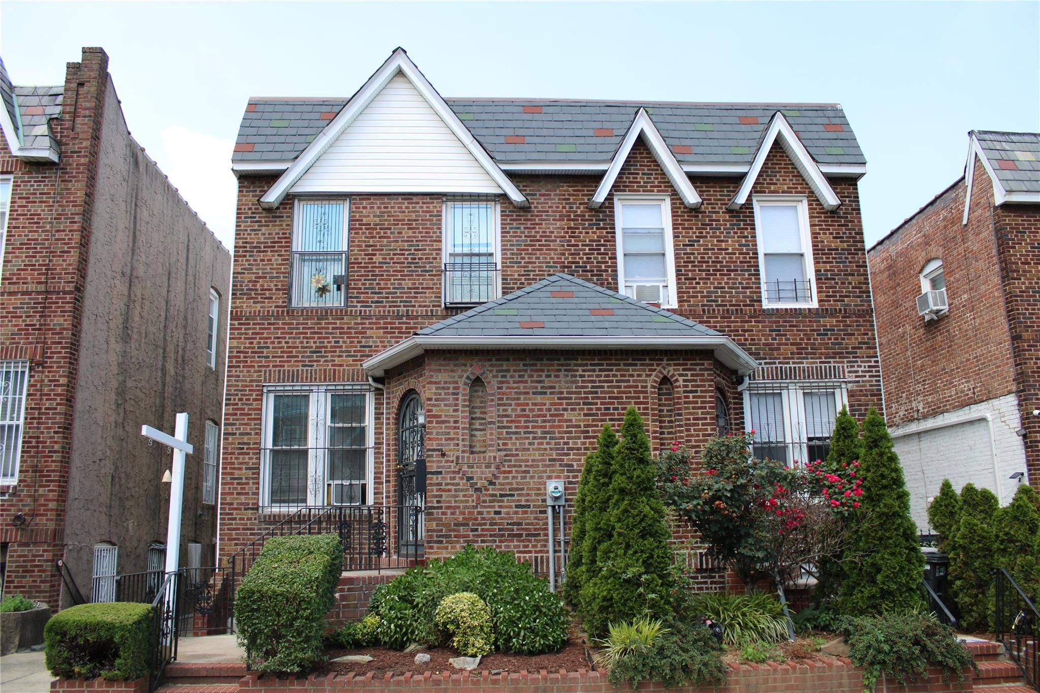 This spacious Tudor home has been converted from a single family to a two family residence.