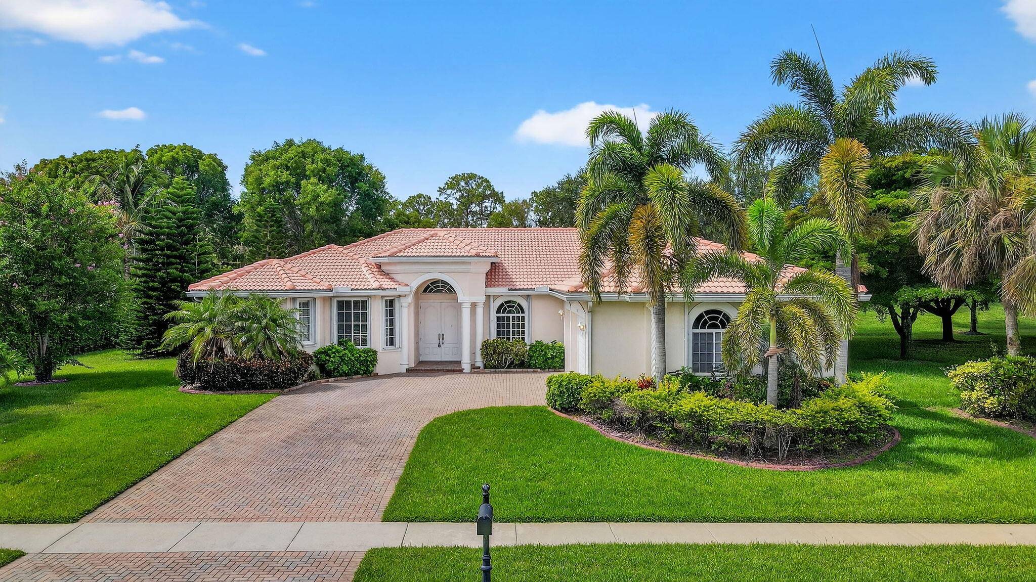 Experience true South Florida luxury in this sprawling 4 bedroom, 3.