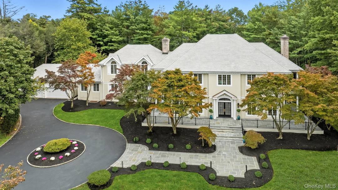 Experience resort style living in this stunning 8, 366 sq ft Mediterranean inspired colonial, perfectly situated on 1.
