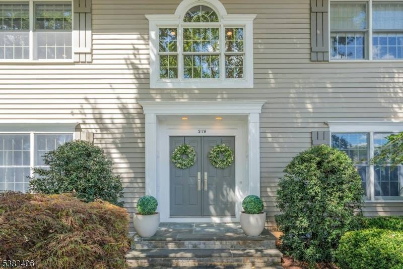 Impeccably designed in collaboration with renowned designer this stunning Wyckoff home is set on a private cul de sac and perched high to capture a rare view of the NYC ...